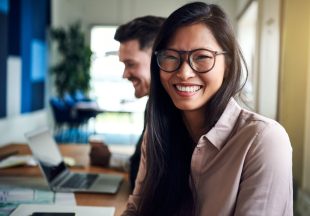 smiling-young-asian-businesswoman-sitting-with-HPT2KJZ-e1583863585994.jpg